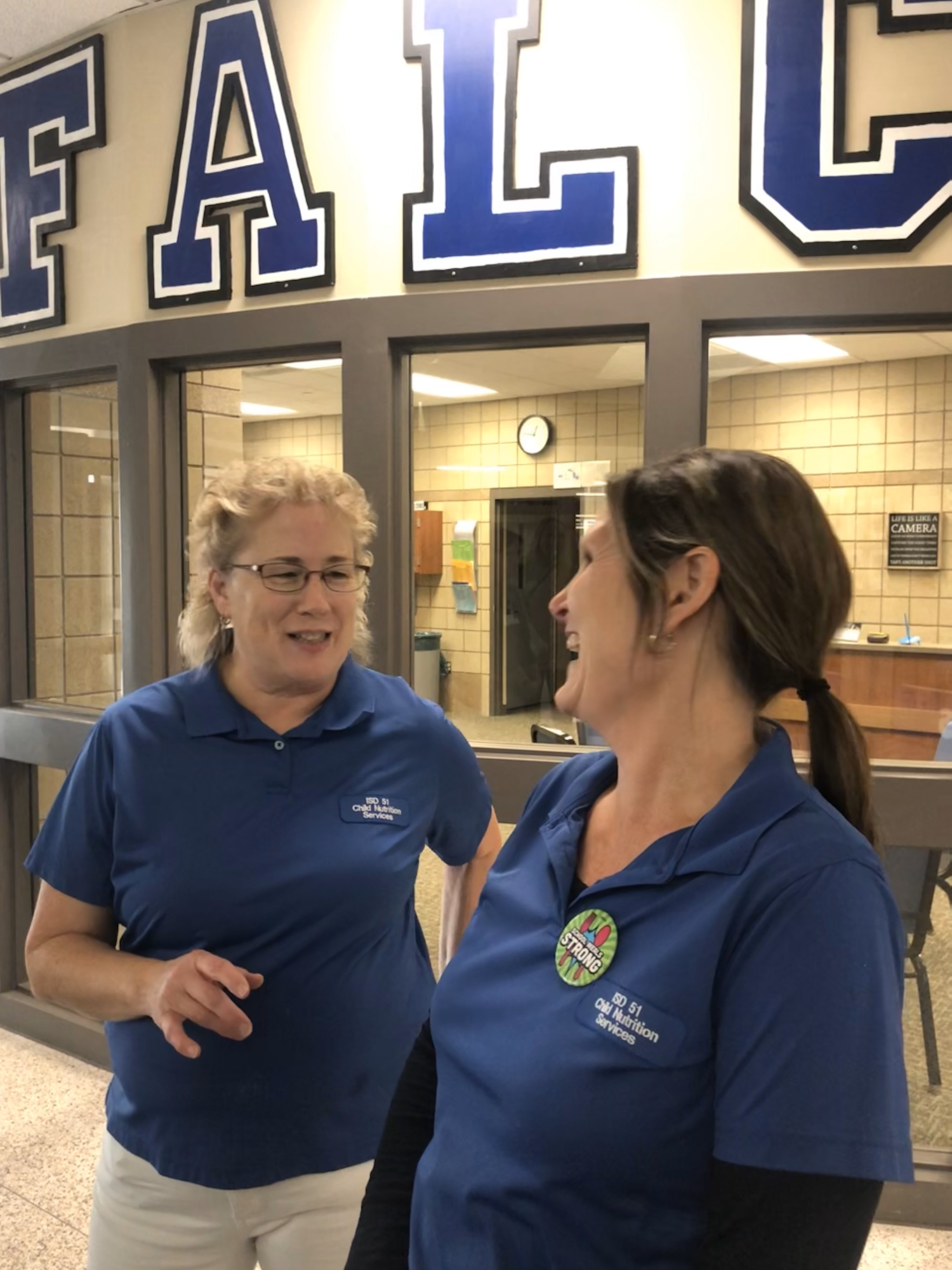 At a Halloween Farm to School Month event, kitchen staff at Hutchinson Middle School show MDA Commissioner Thom Petersen and Lt. Governor Peggy Flanagan kitchen eqipment purchased with a Farm to School grant.
