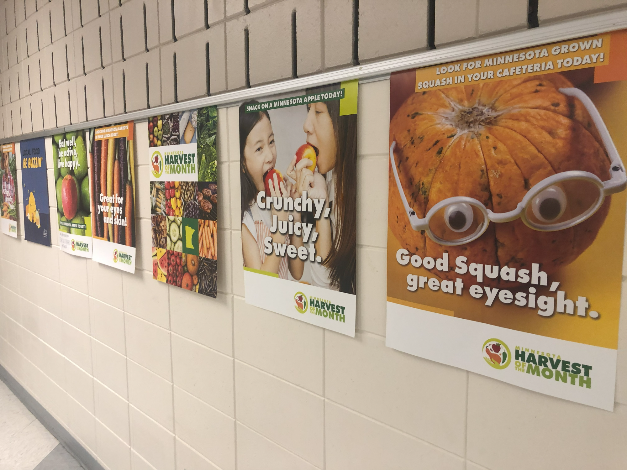 MDA Harvest of the Month posters at a particpating school promote local foods.