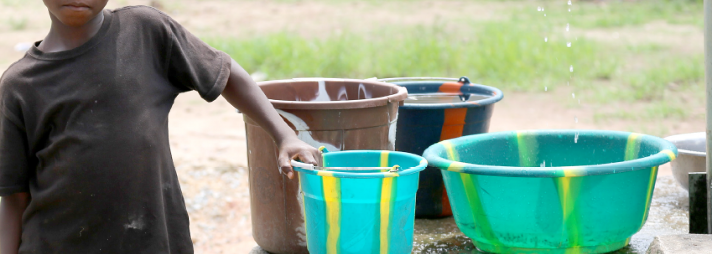 kid with water buckets