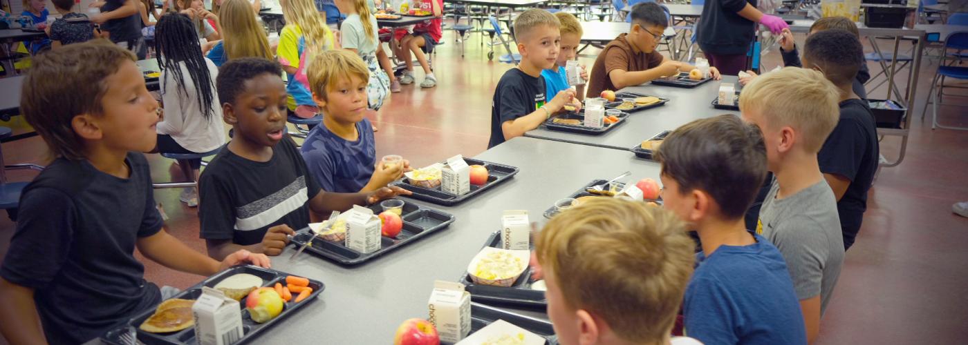 kids at a school lunch table
