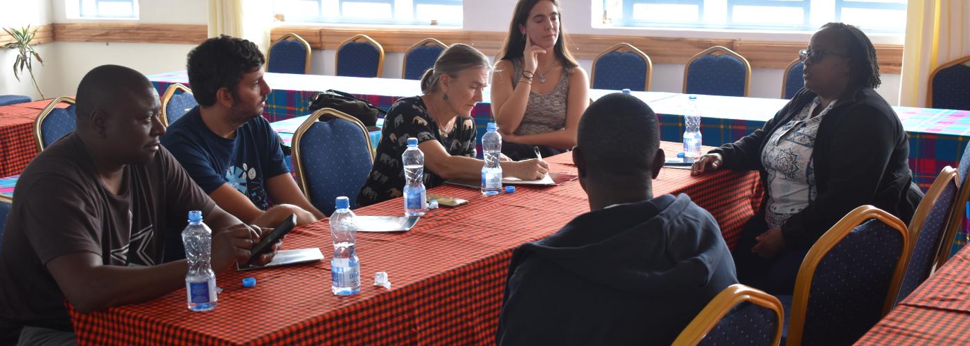 Group of people sitting at a table talking