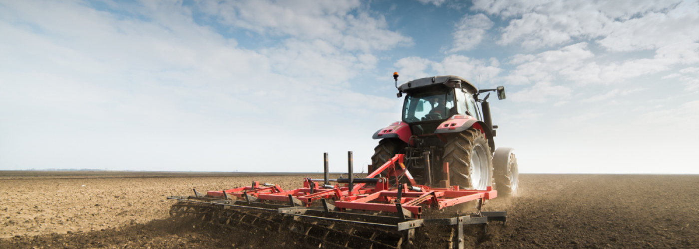 Tractor on dirt field