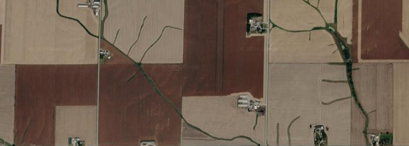 google maps aerial view of rural Iowa with several long white buildings that may be CAFOs.