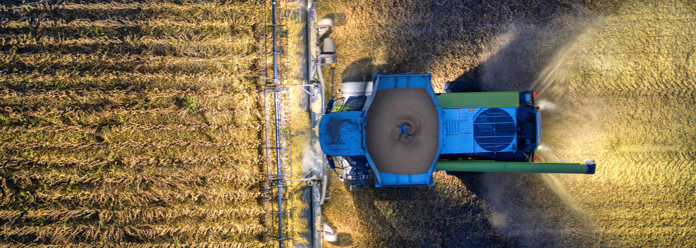 Tractor harvesting field