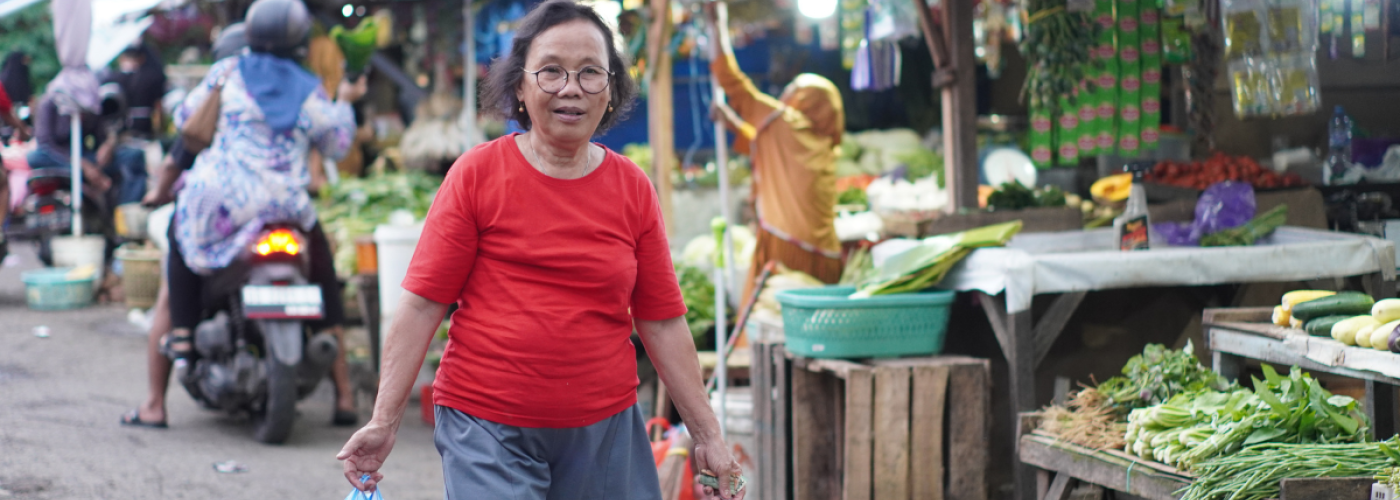 Woman holding bags at market