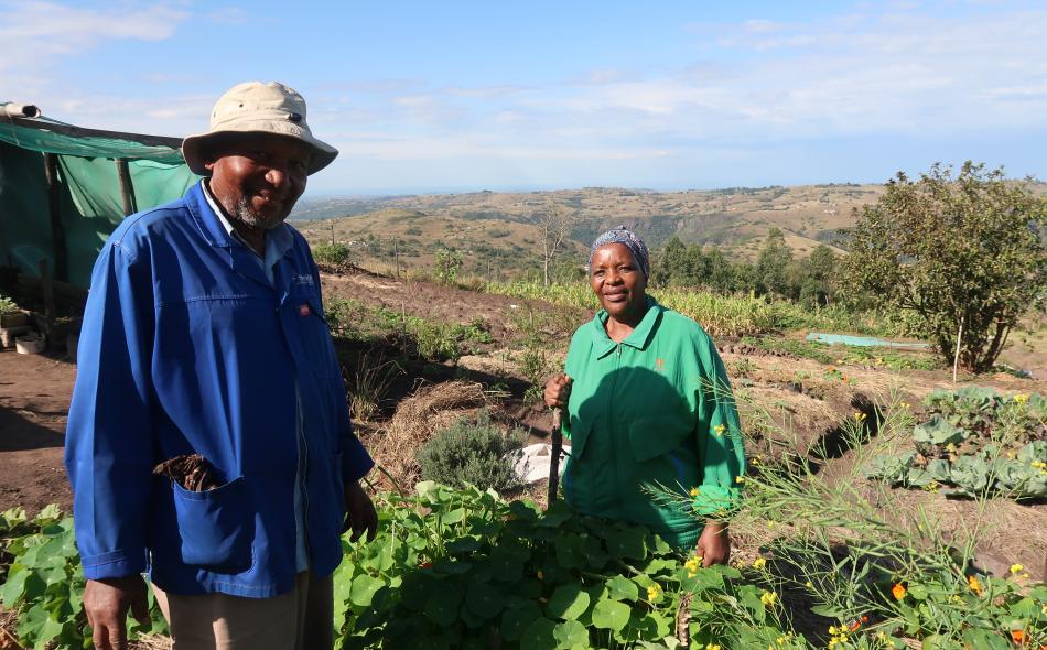 Sthandiwe and Wilson Dlamini Maphumulo in front of their garden in South Africa.