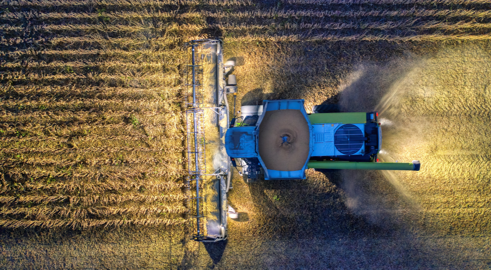 Tractor harvesting field