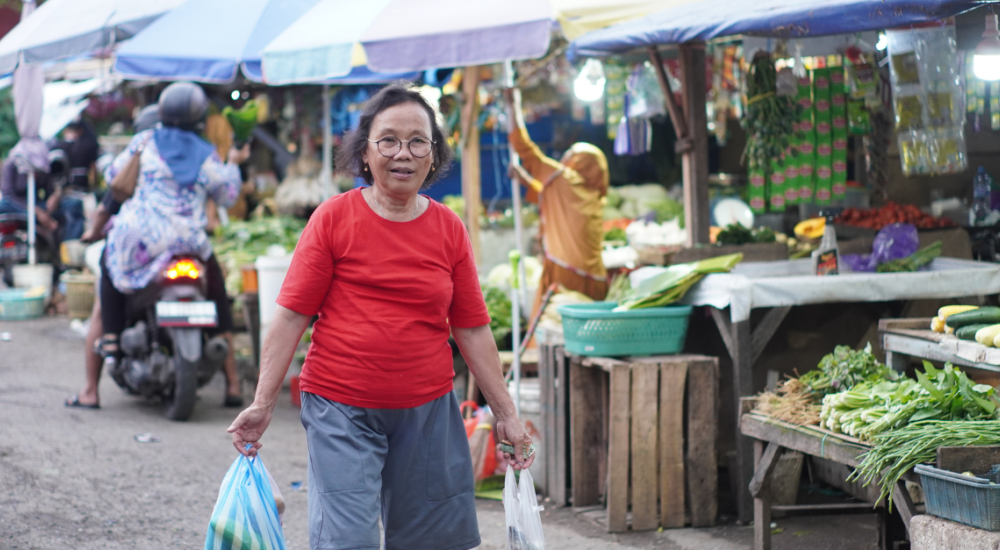 Woman holding bags at market