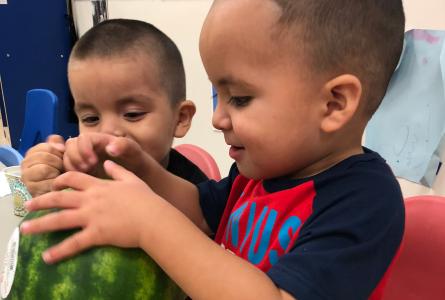 Kids from Tri-Valley Head Start with a watermelon