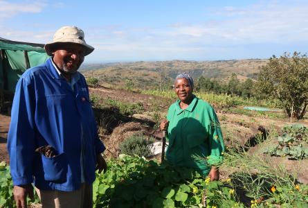 Sthandiwe and Wilson Dlamini Maphumulo in front of their garden in South Africa.