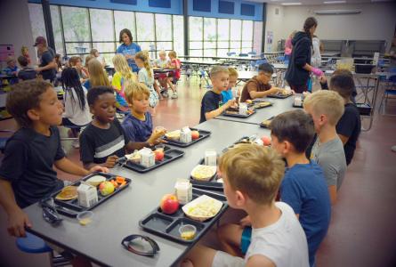 kids at a school lunch table