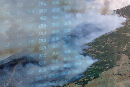 Smoky mountain overlaid with finance market figures