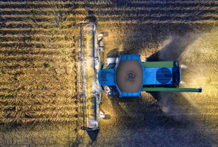 Tractor harvesting field