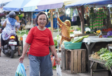 Woman holding bags at market